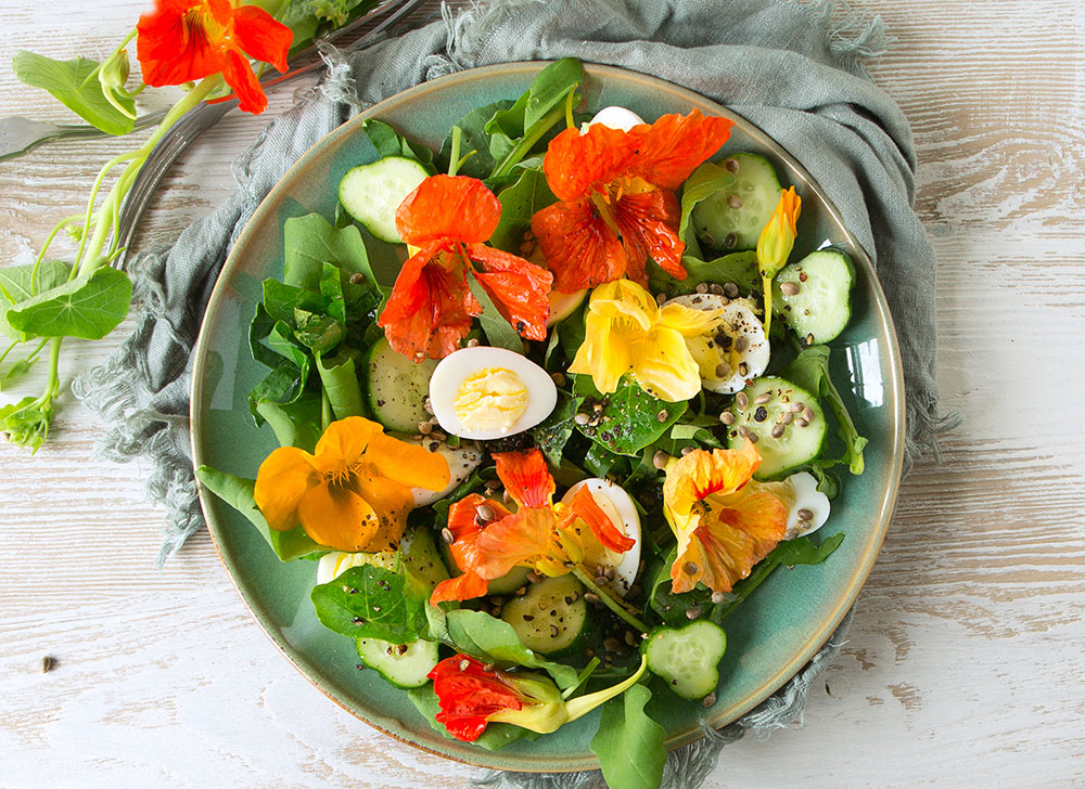 A salad of edible flowers and salad greens